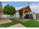 An outdoor backyard pavilion provides shade by the swimming pool at 1253 E Avila Ave, Casa Grande, AZ 85122
