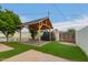 Inviting cabana with stylish patio is perfect for gatherings by pool at 1253 E Avila Ave, Casa Grande, AZ 85122