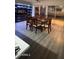 Traditional dining room with dark wood table, chairs, grey floors, and built in cabinets with glass sliding door at 1253 E Avila Ave, Casa Grande, AZ 85122