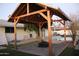 This outdoor space features a charming pergola with a fire pit and views of the sparkling pool at 1253 E Avila Ave, Casa Grande, AZ 85122