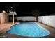 Sparkling in-ground pool with patio, a covered area and a privacy fence perfect for relaxation and outdoor entertaining at 1253 E Avila Ave, Casa Grande, AZ 85122