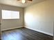 This bedroom features sleek, modern laminate floors and a ceiling fan at 1432 W 7Th St, Tempe, AZ 85281