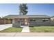 Charming single-story home featuring a well-maintained lawn and a covered carport at 1432 W 7Th St, Tempe, AZ 85281