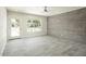 Spacious living room with light gray flooring, a large window and neutral paint at 1432 W 7Th St, Tempe, AZ 85281