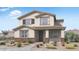 Charming two-story home featuring a neutral palette, tile roof, and neatly landscaped front yard at 14630 W Sand Hills Rd, Surprise, AZ 85387