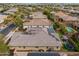Aerial view of a home featuring solar panels, a well-manicured backyard and artificial grass at 14845 W Georgia Dr, Surprise, AZ 85379