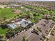 Aerial view of the community pool, clubhouse, baseball field, parking, and recreational areas at 14845 W Georgia Dr, Surprise, AZ 85379