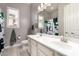 Bathroom featuring a double vanity, large mirror, and modern decor at 14845 W Georgia Dr, Surprise, AZ 85379