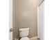 Small bathroom featuring a toilet and shower with white shower curtains at 14845 W Georgia Dr, Surprise, AZ 85379