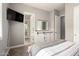 Comfortable bedroom with a mounted TV and an ensuite bathroom at 14845 W Georgia Dr, Surprise, AZ 85379
