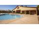 View of the community pool featuring nearby showers and restroom at 14845 W Georgia Dr, Surprise, AZ 85379