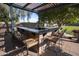 Outdoor bar area under a pergola, perfect for entertaining in style at 14845 W Georgia Dr, Surprise, AZ 85379