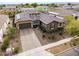 Beautiful single-Gathering home with a brick driveway, stone accents, and a well-maintained front yard at 14845 W Georgia Dr, Surprise, AZ 85379