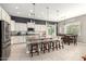 Spacious kitchen featuring a large center island, stainless steel appliances, and dining area at 14845 W Georgia Dr, Surprise, AZ 85379
