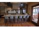Community kitchen featuring a stainless steel appliances, breakfast bar and outdoor access at 14845 W Georgia Dr, Surprise, AZ 85379