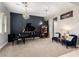 Elegant living room featuring a grand piano, stylish lighting, and comfortable seating arrangement at 14845 W Georgia Dr, Surprise, AZ 85379
