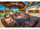 Inviting outdoor patio provides a cozy gathering space with comfortable seating and a built-in grill at 14845 W Georgia Dr, Surprise, AZ 85379