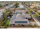 A home featuring solar panels, a well-manicured backyard, a trampoline, and other backyard amenities at 14845 W Georgia Dr, Surprise, AZ 85379