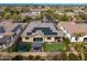 A home with backyard featuring solar panels, well-manicured artificial grass, a hot tub, and a trampoline at 14845 W Georgia Dr, Surprise, AZ 85379
