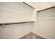 An organized walk-in closet with clothing racks, providing ample storage solutions at 15053 W Gray Fox Trl, Surprise, AZ 85387