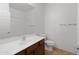 Bright bathroom with a large mirror and a wood-grain vanity with a white countertop at 15240 N 142Nd Ave # 1101, Surprise, AZ 85379