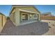 Backyard featuring a covered patio perfect for entertaining, and gravel landscaping at 15818 W Kendall St, Goodyear, AZ 85338