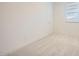 Bedroom with neutral carpet, white walls and window at 15818 W Kendall St, Goodyear, AZ 85338