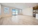 Bright and airy living room with sliding doors and tile flooring at 15818 W Kendall St, Goodyear, AZ 85338