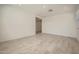 Bright living room with wood-look tile flooring, neutral paint, and recessed lighting at 15818 W Kendall St, Goodyear, AZ 85338
