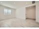 Bright living room featuring wood-look tile flooring and recessed lighting at 15818 W Kendall St, Goodyear, AZ 85338