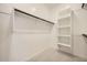 A walk-in closet with rods and shelves at 15818 W Kendall St, Goodyear, AZ 85338