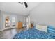 Bright bedroom features a ceiling fan and French doors to a balcony with outdoor views at 16224 S 40Th Pl, Phoenix, AZ 85048