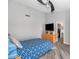 This bedroom features a ceiling fan, closet, tv, and an adjoining bathroom at 16224 S 40Th Pl, Phoenix, AZ 85048