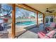 Inviting covered patio area overlooking the sparkling pool, offering a relaxing outdoor living space at 16224 S 40Th Pl, Phoenix, AZ 85048
