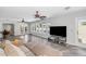 Bright living room with wood floors, ceiling fans and multiple windows at 16224 S 40Th Pl, Phoenix, AZ 85048