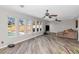 Bright living room with wood floors, ceiling fans and large windows overlooking the backyard at 16224 S 40Th Pl, Phoenix, AZ 85048
