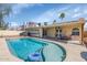 Backyard oasis featuring a pristine in-ground pool, covered patio, and solar panels for energy efficiency at 16224 S 40Th Pl, Phoenix, AZ 85048
