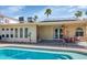 Refreshing backyard pool with solar panels, offering a serene escape for hot summer days at 16224 S 40Th Pl, Phoenix, AZ 85048