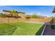 Spacious backyard with artificial turf, rock border and privacy wall, perfect for outdoor enjoyment at 16510 W Tether Trl, Surprise, AZ 85387