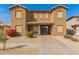 Charming two-story townhome features a desert landscape and covered entryway at 16510 W Tether Trl, Surprise, AZ 85387