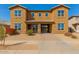 A charming two-story home with a private front entrance and desert landscaping at 16510 W Tether Trl, Surprise, AZ 85387