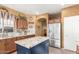 Kitchen features stainless steel appliances, granite countertops, and central island at 16510 W Tether Trl, Surprise, AZ 85387