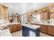 Open kitchen flows into dining room featuring granite countertops and wood cabinets at 16510 W Tether Trl, Surprise, AZ 85387