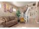 Cozy living room boasts high ceilings and a staircase leading to the second floor at 16510 W Tether Trl, Surprise, AZ 85387