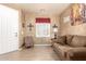 Comfortable living room offers a serene retreat with neutral colors and bright light at 16510 W Tether Trl, Surprise, AZ 85387