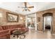 Relaxing living room offers stylish decor and seamless access to the outdoor area at 16510 W Tether Trl, Surprise, AZ 85387