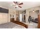 Main bedroom with carpet flooring and large open entrance to en-suite bathroom at 16510 W Tether Trl, Surprise, AZ 85387