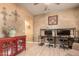 Functional office space offers ample room for dual monitors and a stylish red cabinet at 16510 W Tether Trl, Surprise, AZ 85387