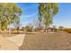 Community park featuring mature trees, walking paths, a playground, and picnic area at 16510 W Tether Trl, Surprise, AZ 85387
