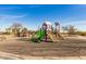 Community playground with slides, climbing structure, and a covered picnic area at 16510 W Tether Trl, Surprise, AZ 85387